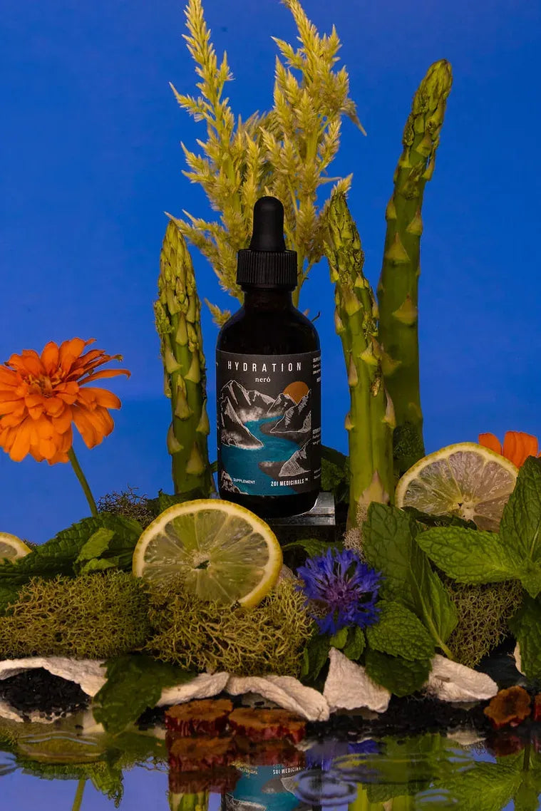Hydration · Neró herbal tincture among garden flowers and herbs