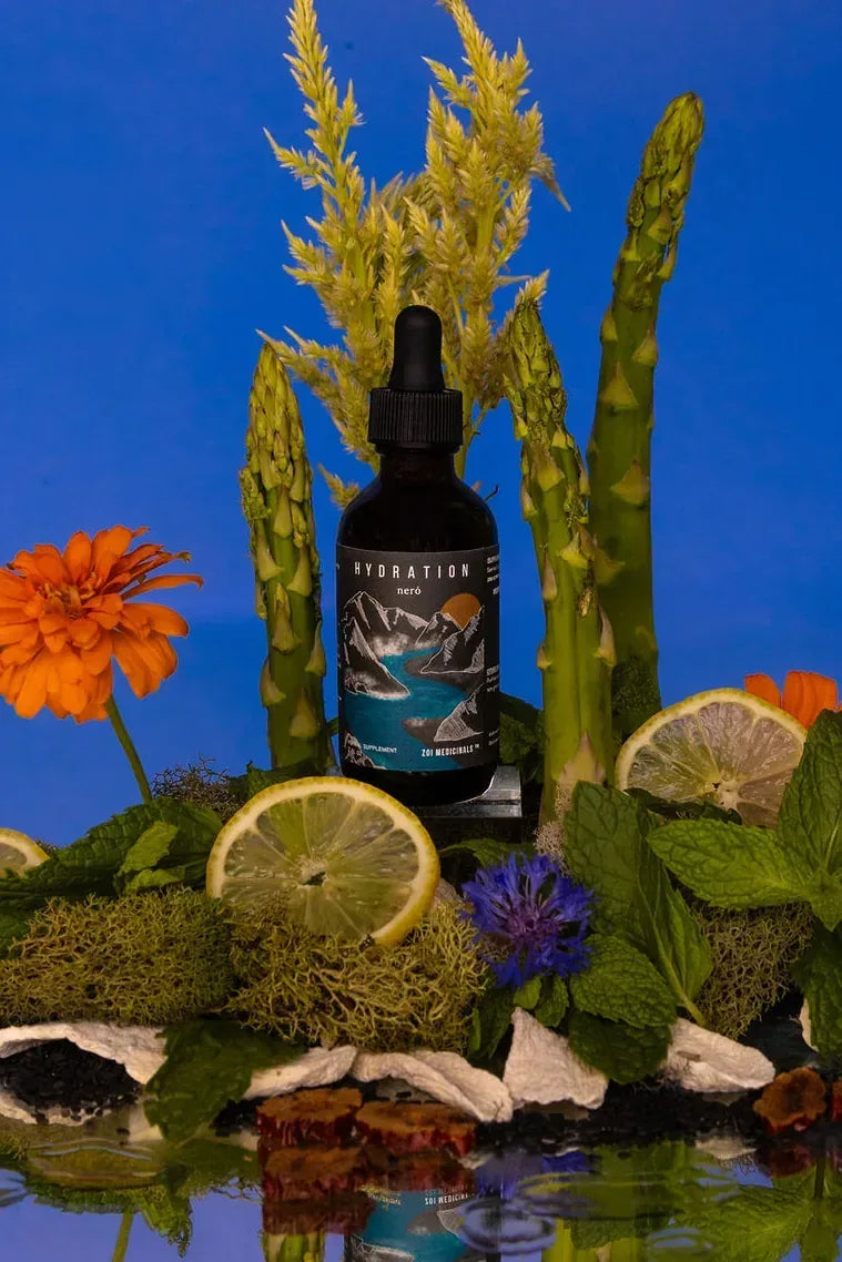 Hydration · Neró herbal tincture among garden flowers and herbs